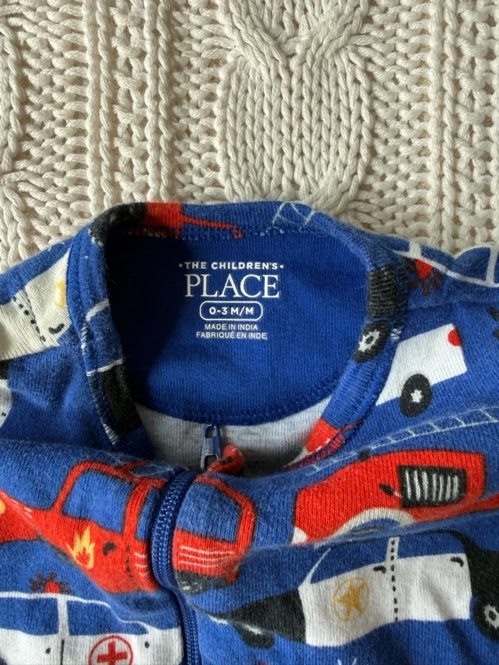 Children’s Place Blue Emergency Vehicle Print Footed One-Piece for Kids 0-3M